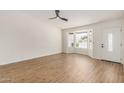 Bright living room showcasing a large bay window, and modern flooring at 2124 E Boston St, Chandler, AZ 85225