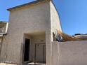 Two-story home with a gated front patio and shade sail at 244 E Ponderosa Ln, Phoenix, AZ 85022