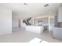Spacious kitchen with a large center island and stainless steel appliances at 35234 N Barley St, San Tan Valley, AZ 85144