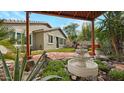 Beautiful backyard fountain and patio area, perfect for outdoor enjoyment and relaxation at 4073 E Stable Ct, Gilbert, AZ 85297