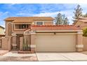 Two-story home featuring a red tile roof, stucco exterior, and well-kept landscaping at 529 E Taro Ln, Phoenix, AZ 85024