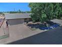 An aerial view shows the home's location and access to a large driveway and a two-car garage at 5932 E Colby St, Mesa, AZ 85205