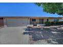 Cozy single-story home features a two car garage and easy care front yard at 5932 E Colby St, Mesa, AZ 85205