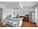Contemporary kitchen with a granite island, stainless steel appliances, and a bright atmosphere, creating a functional and inviting space at 6906 E 4Th St # 4, Scottsdale, AZ 85251