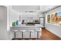 Modern kitchen with a granite countertop island, stainless steel appliances, and sleek cabinetry, perfect for cooking and entertaining at 6906 E 4Th St # 4, Scottsdale, AZ 85251