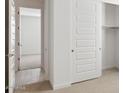 Bedroom featuring sliding closet doors, carpet, and wood look flooring at 7369 W Buckhorn Trl, Peoria, AZ 85383