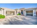 Spacious home features three-car garage spaces and extra long driveway for parking at 853 E Ivanhoe Ct, Gilbert, AZ 85295