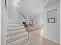 Inviting entryway showcasing an open staircase and seamless flow into the spacious living area at 910 S Crossbow Ct, Chandler, AZ 85225