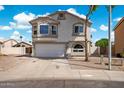 Charming two-story home featuring a well-maintained front yard and a two-car garage at 910 S Crossbow Ct, Chandler, AZ 85225