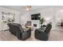 Spacious living room showcasing sleek furniture, modern fireplace, and bright, neutral decor at 9312 E Spiral Ave, Mesa, AZ 85212