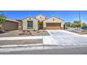 Attractive single-level home boasting a two-car garage, lush front yard, and a welcoming entrance at 10548 W Crown King Rd, Tolleson, AZ 85353