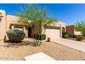 Charming one-story home with desert landscaping, two-car garage and a cozy front entrance at 10863 N 117Th Pl, Scottsdale, AZ 85259