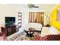 Cozy living room with ceiling fan and large windows at 133 W Balboa Dr, Tempe, AZ 85282
