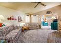Cozy living room featuring plush carpeting, neutral walls, and large windows for abundant natural light at 1640 E Augusta Ave, Chandler, AZ 85249