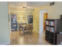 Inviting dining room with stylish light fixture, books, and wood floors at 1825 W Ray Rd # 1134, Chandler, AZ 85224