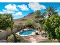 Backyard oasis with private pool, desert landscaping, and mountain views at 1922 E Everett Dr, Phoenix, AZ 85022