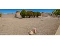 A charming single-Gathering home boasting a well-maintained xeriscaped front yard and mature trees at 19251 N 17Th Dr, Phoenix, AZ 85027