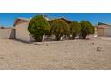 Single-Gathering home boasting a well-maintained xeriscaped front yard and mature trees at 19251 N 17Th Dr, Phoenix, AZ 85027