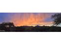Scenic mountain view landscape, exhibiting desert flora during a vividly colorful sunset at 19475 N Grayhawk Dr # 1115, Scottsdale, AZ 85255