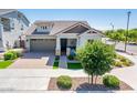Charming single-Gathering home boasting a well-maintained lawn, paver driveway, and welcoming front porch at 2611 S Quaintance St, Gilbert, AZ 85295