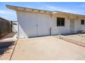 This is a side-view of the garage, showing the concrete driveway and brick-lined edge at 2834 E Michael Dr, Phoenix, AZ 85032