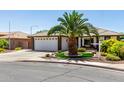 Charming single-story home with a two-car garage and desert landscaping at 2910 S Olivewood --, Mesa, AZ 85212