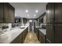 Modern kitchen features a long quartz countertop, stainless appliances and stylish cabinets at 308 E La Jolla Dr, Tempe, AZ 85282