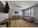 Cozy living room featuring tile floors, neutral paint and plantation shutters at 308 E La Jolla Dr, Tempe, AZ 85282