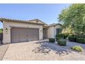 Lovely home with a neutral exterior, tile roof, and brick paver driveway at 3280 E Coconino Dr, Gilbert, AZ 85298