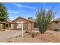 A home exterior showcasing desert landscaping and a neutral color palette at 3353 E Blackhawk Dr, Phoenix, AZ 85050