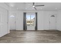 Bright and airy living room featuring new floors, fresh paint, and lots of natural light at 3754 W Hearn Rd, Phoenix, AZ 85053