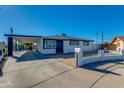 Charming single-story home with a manicured lawn and inviting curb appeal at 3944 W Wilshire Dr, Phoenix, AZ 85009