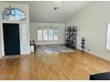 Bright living room showcasing hardwood floors, high ceilings, and large windows at 4102 E Rancho Tierra Dr, Cave Creek, AZ 85331