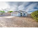 Charming single-story home with tile roof, two-car garage, and low maintenance front yard at 5230 E Pony Track Ln, San Tan Valley, AZ 85140