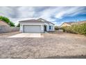 Charming single-story home with tile roof, two-car garage, and low maintenance front yard at 5230 E Pony Track Ln, San Tan Valley, AZ 85140