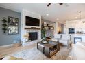Inviting living room with a cozy fireplace, comfortable seating, and easy access to the kitchen at 5515 S Caisson Way, Mesa, AZ 85212