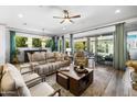 Spacious living room with modern finishes, tile flooring, and abundant natural light at 5515 S Caisson Way, Mesa, AZ 85212