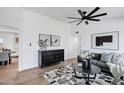 Bright living room featuring modern décor, a ceiling fan, and stylish furniture on hardwood floors at 640 S 34Th St, Mesa, AZ 85204