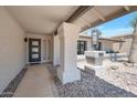 Inviting front entry with modern door, decorative stones, and stylish accents at 6620 E Paradise Ln, Scottsdale, AZ 85254