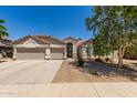 Charming single-story home with a well-manicured front yard and a welcoming entrance at 6958 W Morning Dove Dr, Glendale, AZ 85308