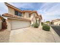 Two-story home with a tile roof, two-car garage, and a well-maintained yard in a residential neighborhood at 7110 N 28Th Dr, Phoenix, AZ 85051