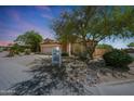 Charming single-story home with a desert-landscaped front yard, spacious driveway, and a two-car garage at 7307 E Black Rock Rd, Scottsdale, AZ 85255