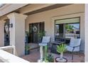 Cozy front patio with comfortable seating and potted plants at 8936 N 80Th Pl, Scottsdale, AZ 85258