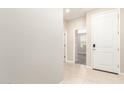 Bright entryway with tile flooring and a view to the carpeted interior at 9535 E Tupelo Ave, Mesa, AZ 85212