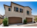 Two-story home with stucco exterior and brown garage doors at 1153 W Diamondback Dr, Chandler, AZ 85286