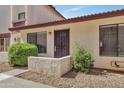 Inviting single-story home with landscaped front and secure screen door at 15435 N 28Th St # 3, Phoenix, AZ 85032