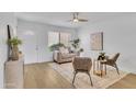 Cozy living room features a modern ceiling fan, lots of natural light, and a calming aesthetic at 15435 N 28Th St # 3, Phoenix, AZ 85032