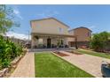 Outdoor enjoyment awaits with this landscaped backyard featuring grass and patio seating at 198 E Patton Ave, Coolidge, AZ 85128