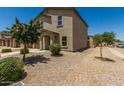 Charming two-story home with desert landscaping and a welcoming facade at 198 E Patton Ave, Coolidge, AZ 85128