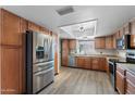 Spacious kitchen featuring stainless steel appliances, wooden cabinetry, and plenty of counter space at 2804 N Nebraska St, Chandler, AZ 85225